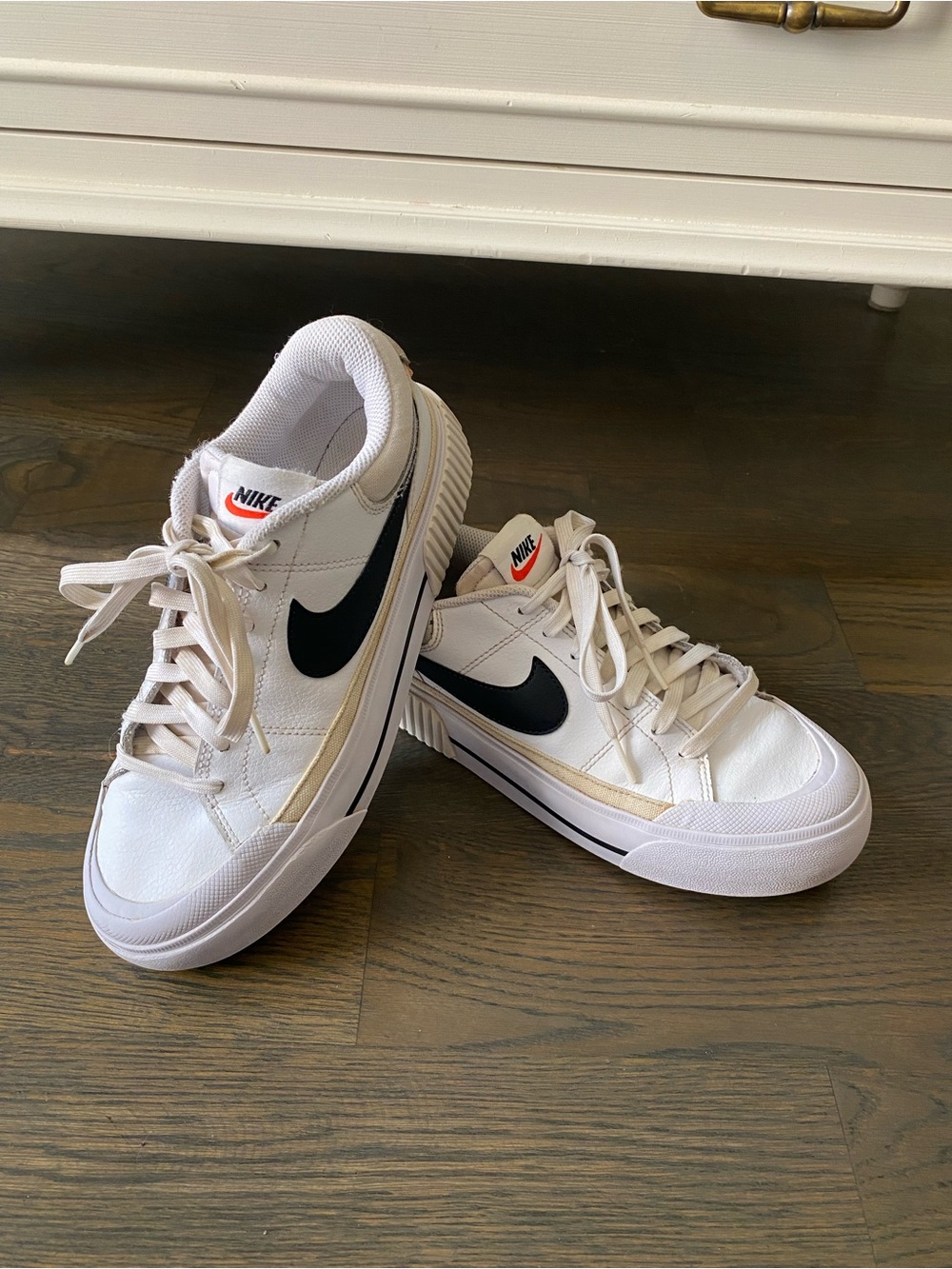 Nike White Low-Top Sneakers with Black Swoosh